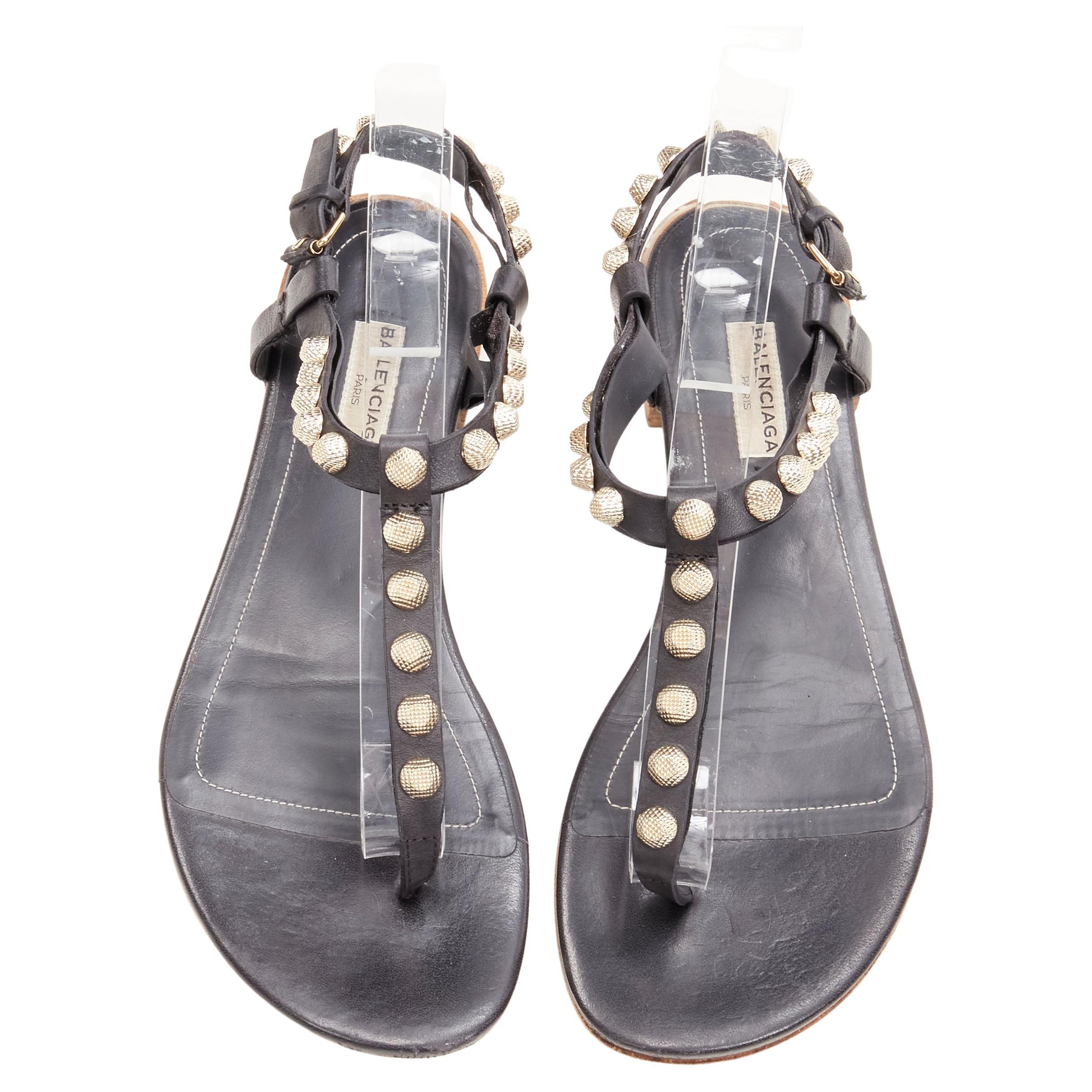 BALENCIAGA Cagole black leather gold textured  stud T-strap flat sandals EU38 For Sale
