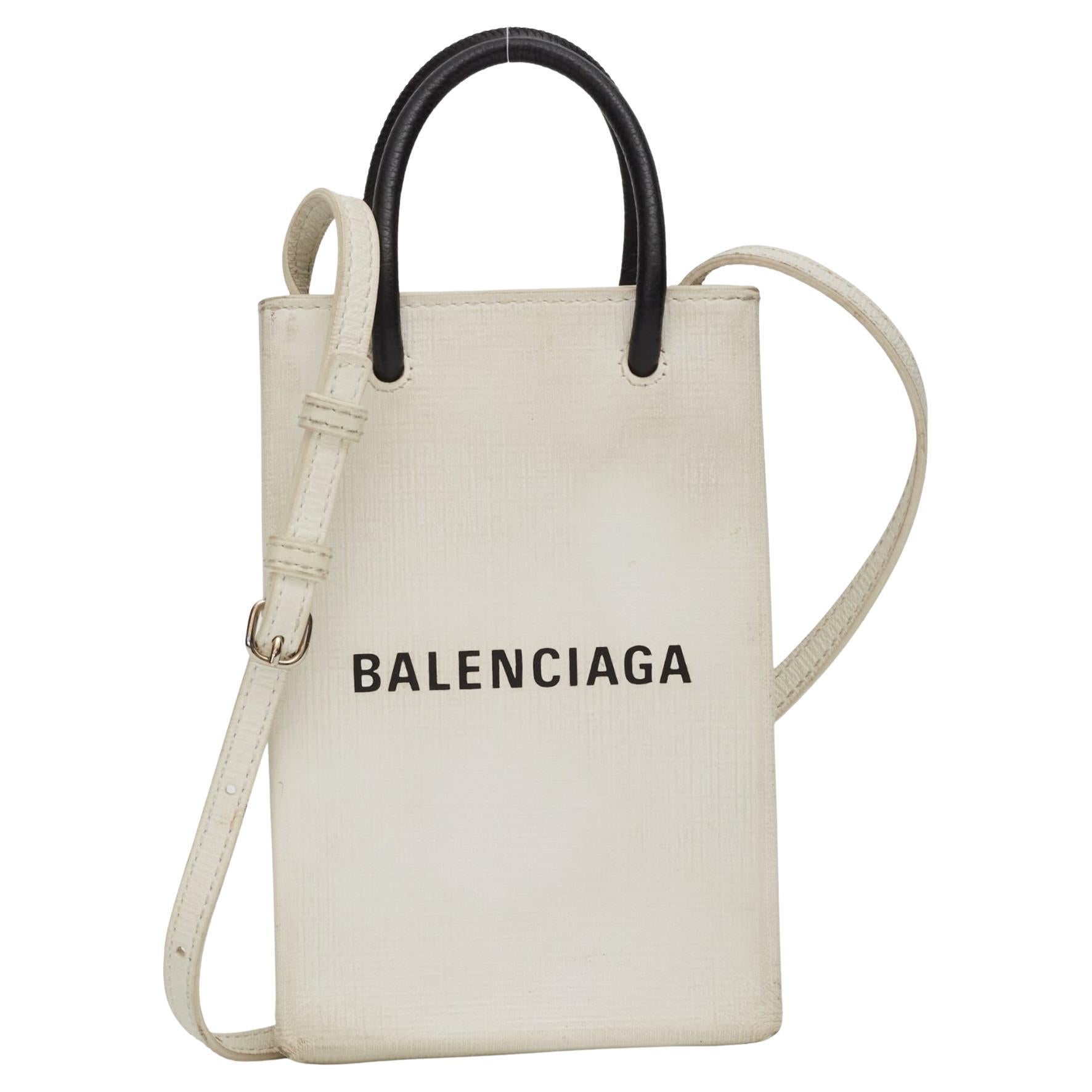 Sac porte-téléphone en cuir de veau avec logo Balenciaga en vente