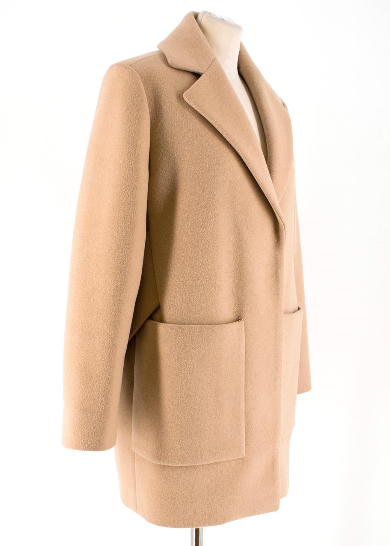 Balenciaga Camel Wool Coat

-Camel wool coat with tortoiseshell buttons
-Two front pockets
-Features back belt
-Shoulder pads
-Notched lapels

Please note, these items are pre-owned and may show signs of being stored even when unworn and unused.
