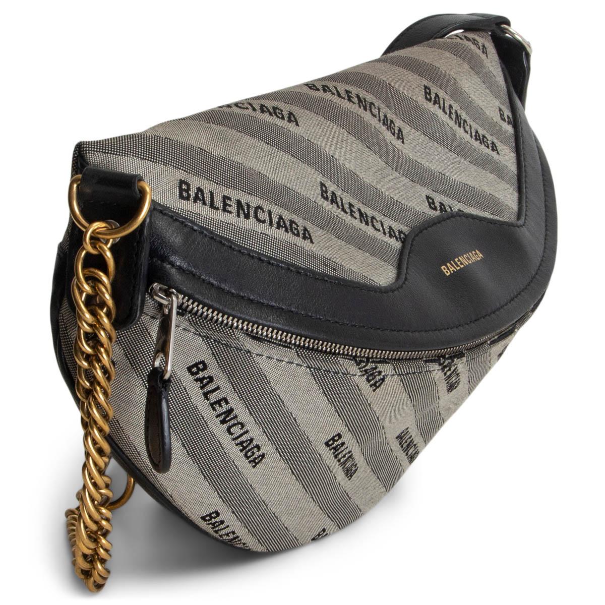 100% authentic Balenciaga 'Souvernirs XS' belt bag in grey monogram jacquard with black leather details. Can be worn as a hip pack or shoulder bag. Used to have a chain strap with Paris Souvernir charms that got removed. Zipper pocket on the outside