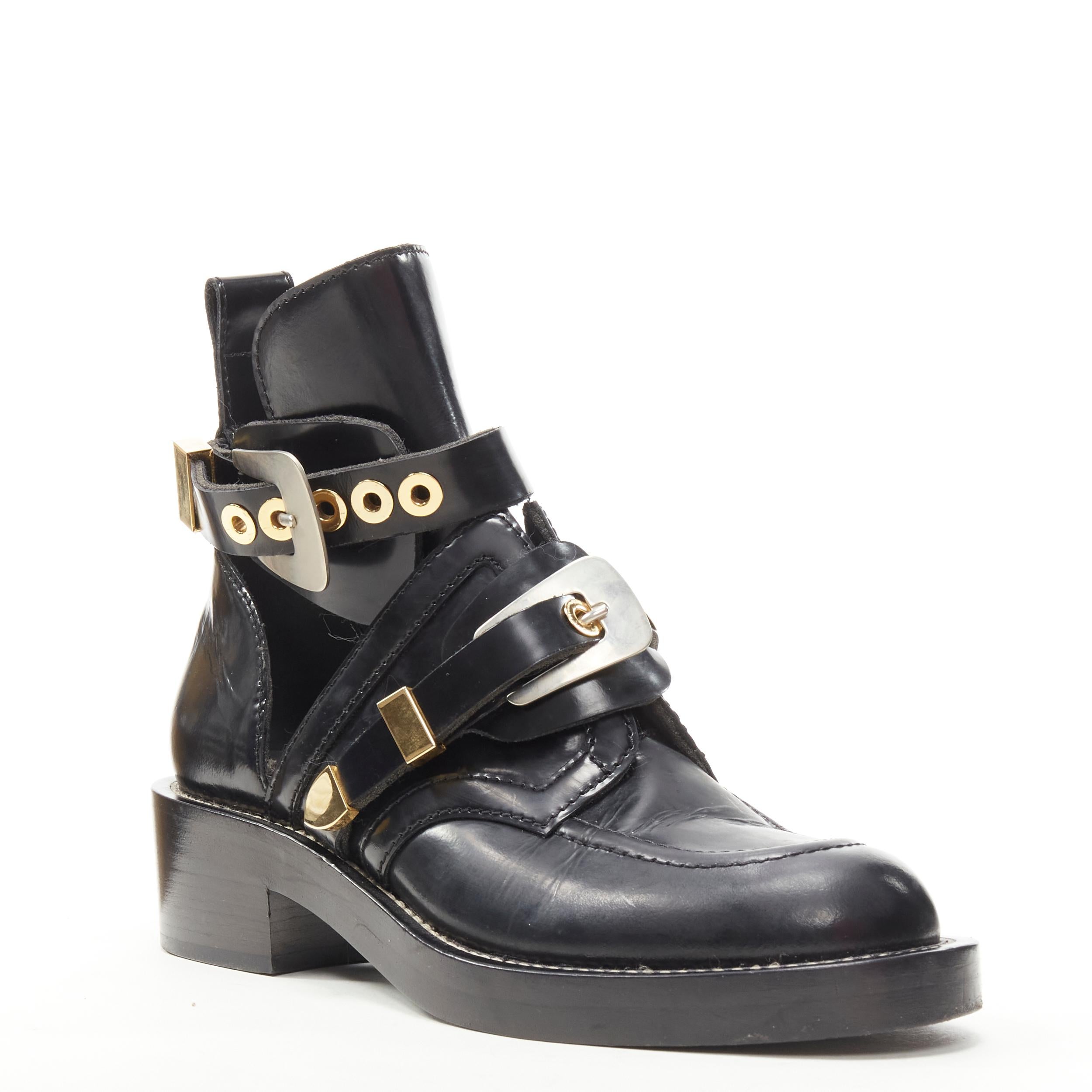 BALENCIAGA Ceinture black leather cut out mixed metals buckle moto boot EU39 
Reference: KEDG/A00122 
Brand: Balenciaga 
Material: Leather 
Color: Black 
Pattern: Solid 
Closure: Buckle 
Extra Detail: Mixed metal hardware. Polished leather upper.