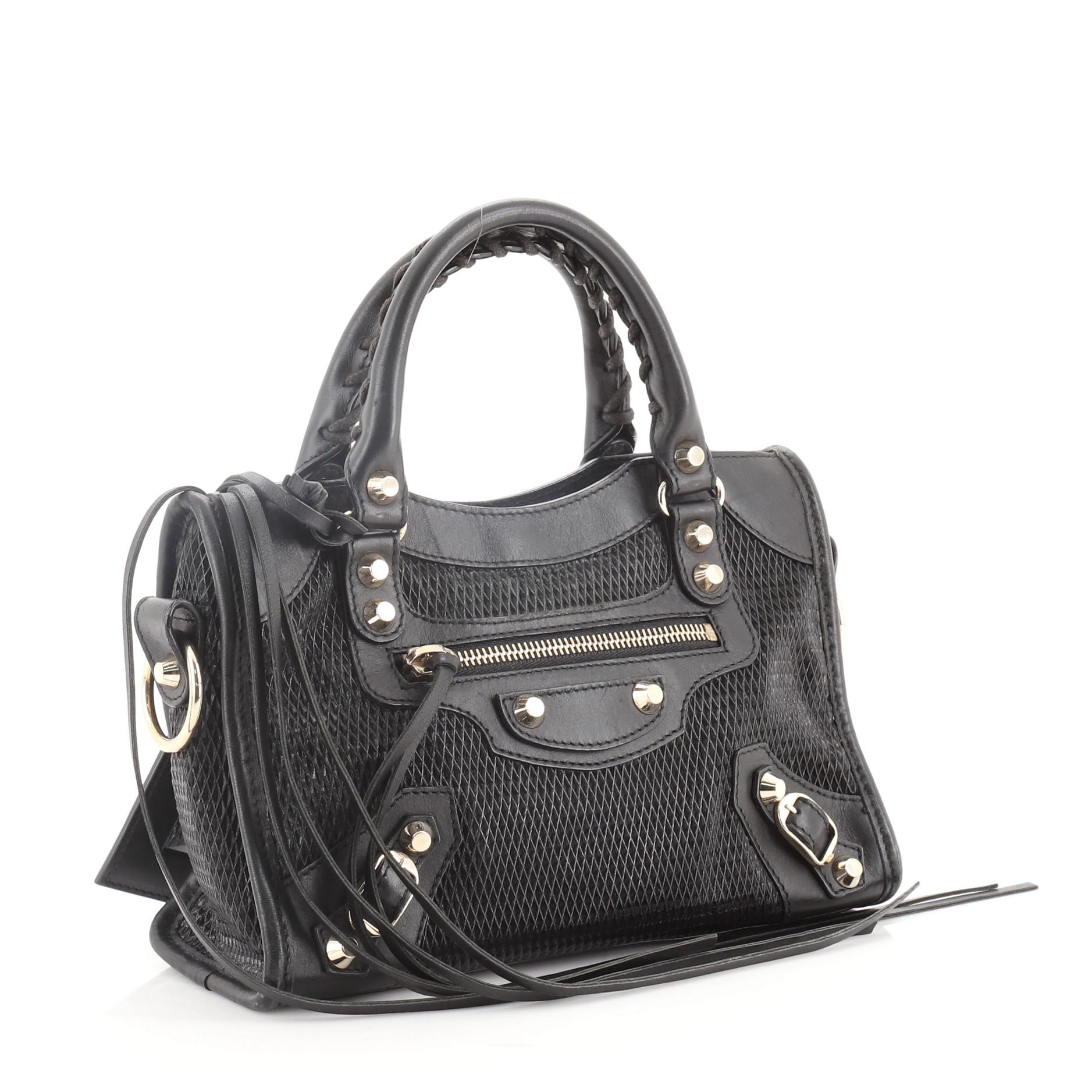 Balenciaga City Classic Studs Bag Perforated Leather Mini
Black Perforated Leather

Condition Details: Creasing on base, moderate wear, scuffs, and discoloration on exterior, handles, strap and in interior. Cracking on handle and opening trim corner