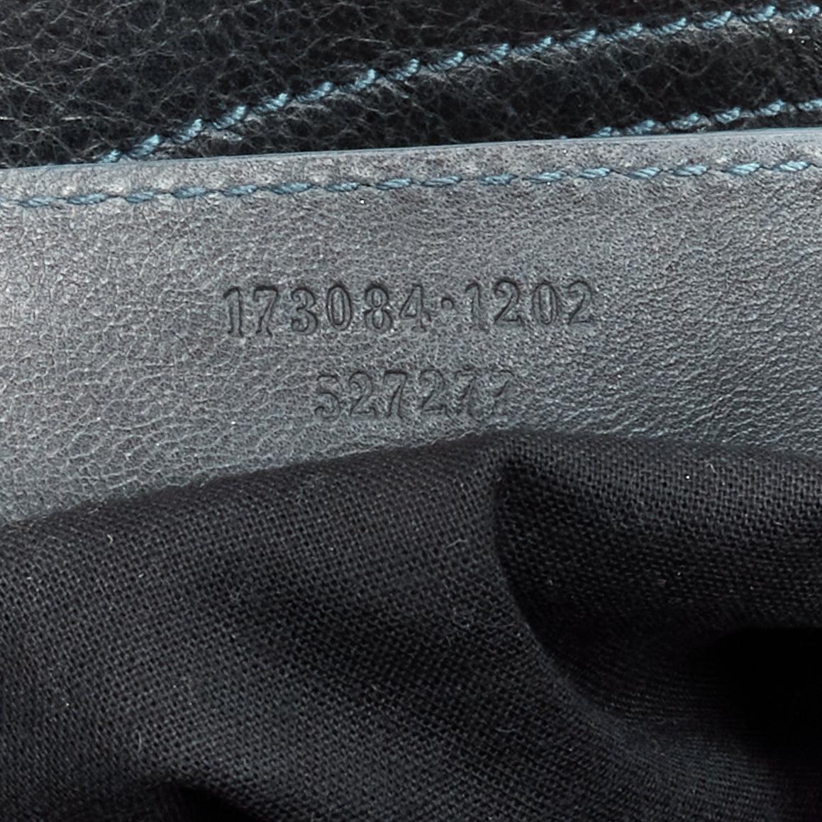 Balenciaga City in pelle verde scuro, con borchie in rame e manico superiore. 7