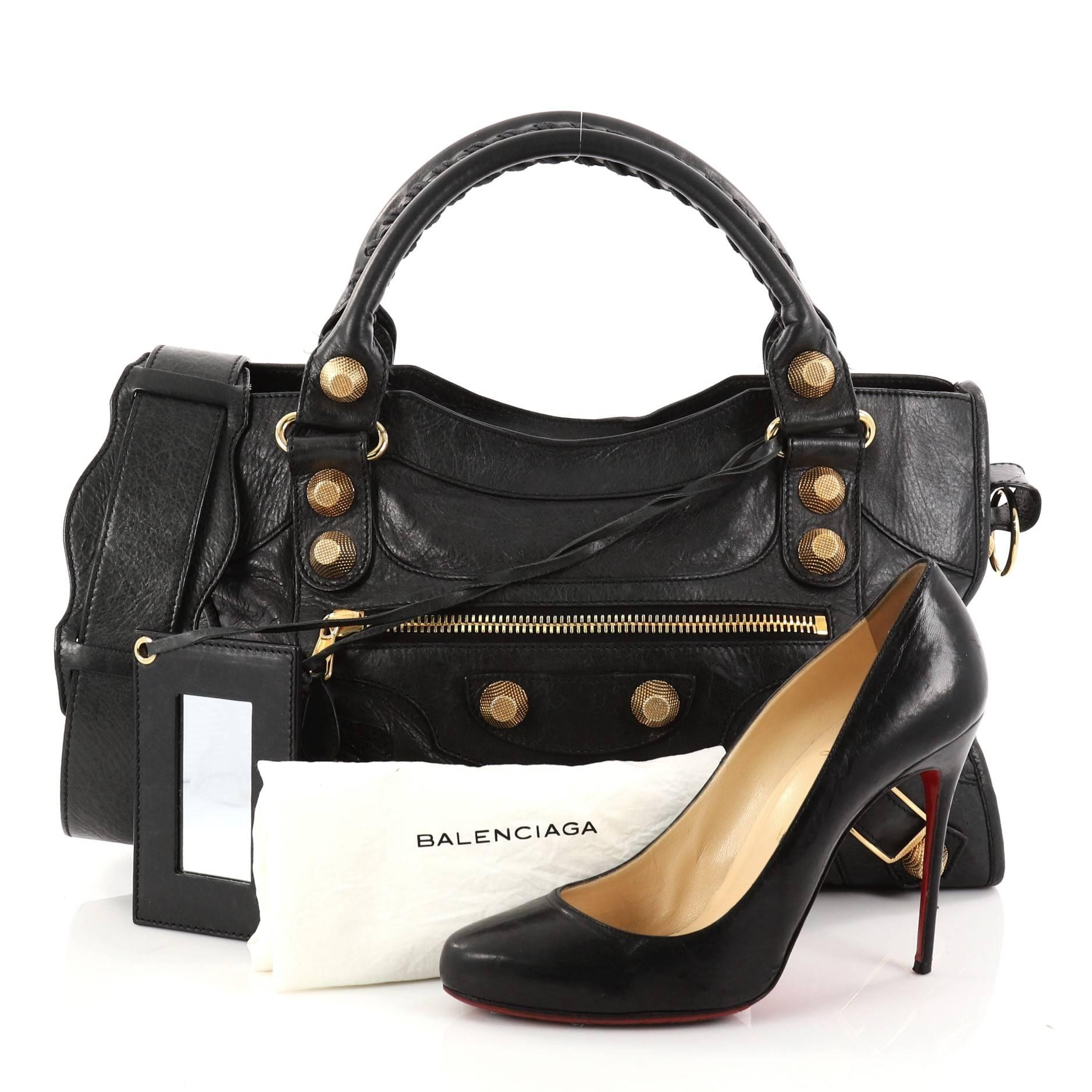 This authentic Balenciaga City Giant Studs Handbag Leather Medium is for the on-the-go fashionista. Constructed from black leather, this popular bag features dual braided woven tall handles, exterior front zip pocket, iconic Balenciaga giant studs