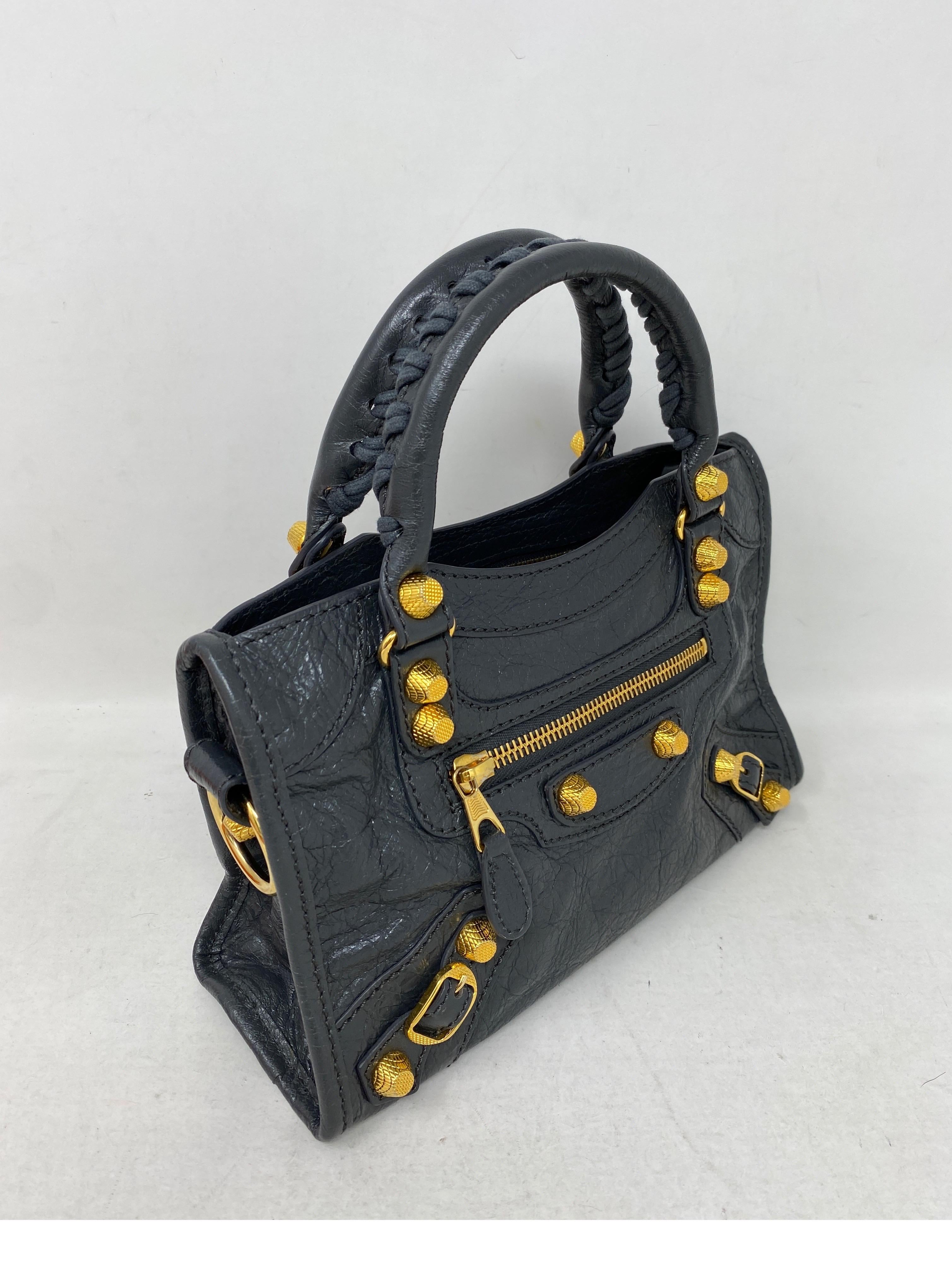Balenciaga City Mini Bag. Dark grey/ black mini leather bag. Super cute style. Gold studded details. Excellent like new condition. Guaranteed authentic. 