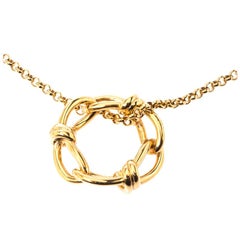 Balenciaga Continuity Bow Gold Tone Circular Pendant Necklace