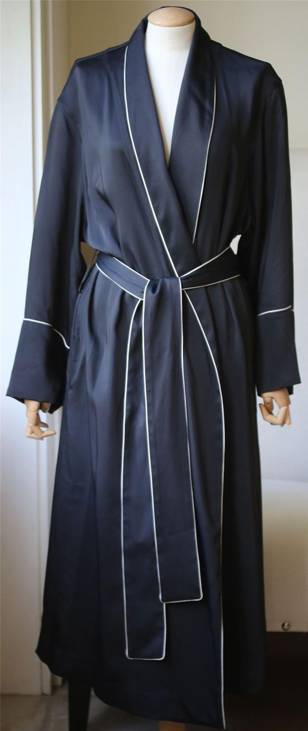 This black Balenciaga contrast piping robe jacket is going to take good care of you both inside and outside of the bedroom. Featuring a shawl collar, long sleeves, a self-tie waist belt and contrast white piping throughout. 82% Viscose, 18%