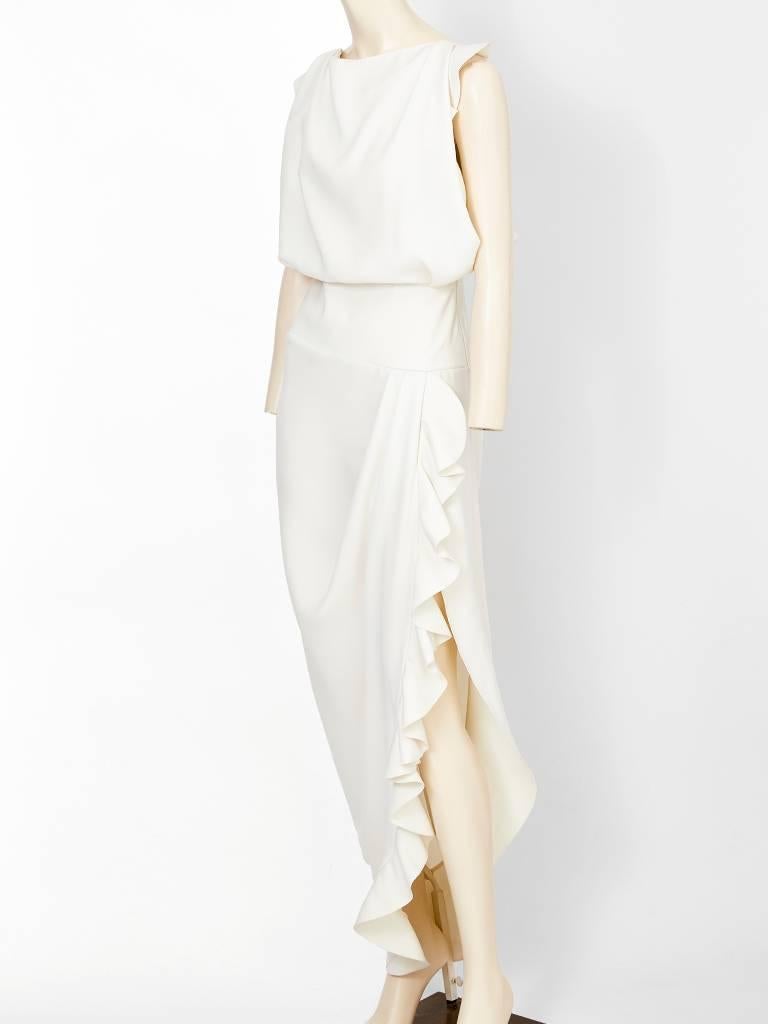 Nicolas Ghesquiere for Balenciaga, white, sculpted crepe, evening dress having ruffle detail along the asymmetric side slit which exposes the leg and at the back.
Back is open, having straps that criss cross. Bodice is slightly blouson at the