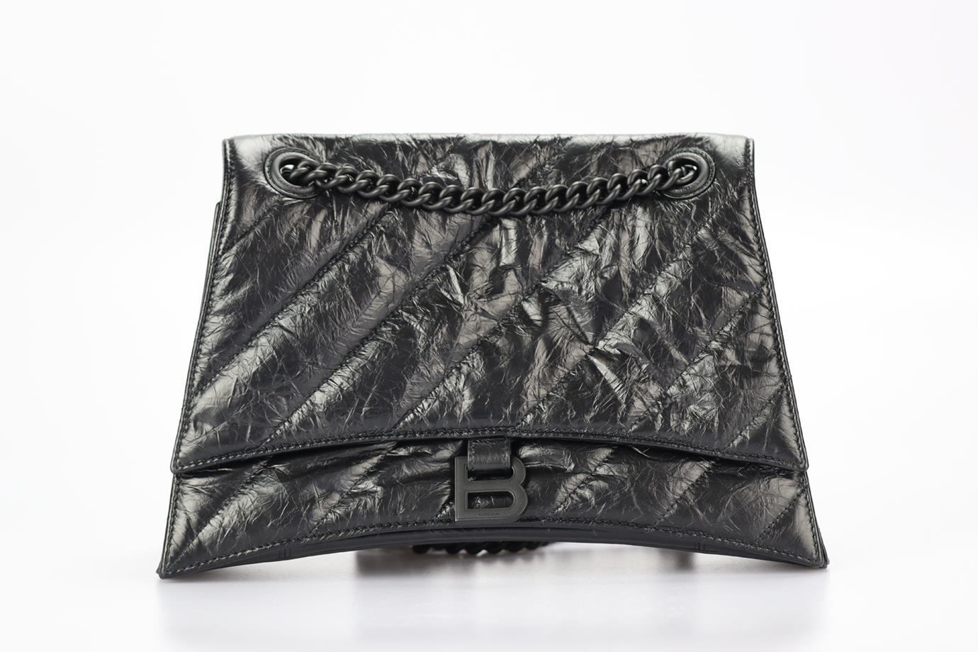 Balenciaga Crush Medium Quilted Leather Shoulder Bag. Black. Magnetic fastening - Front. Comes with - dustbag. Leather. Height: 8.1 in. Width: 11.6 in. Depth: 4 in. Handle drop: 12 in. Strap drop: 22 in. Condition: Used. Very good condition - Loose