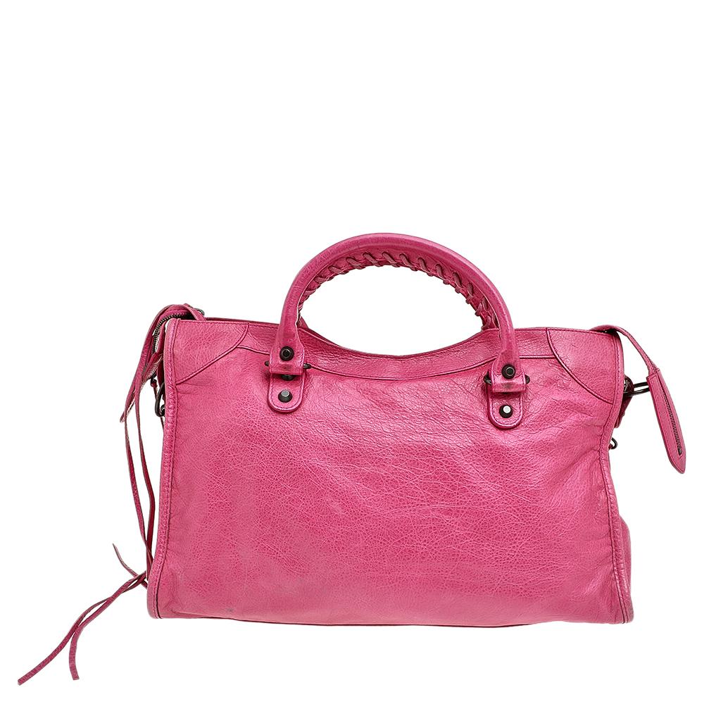 Balenciaga is known for its finely made products and the City bags are one of them. Effortless and stylish, this leather bag will be your go-to for multiple occasions. It has the signature details of buckles, studs, and the front zipper. Two top