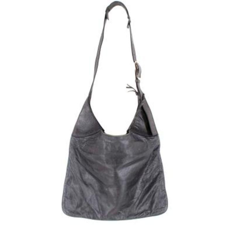 Balenciaga Buckle Stone Leather Shoulder Bag

- Supple leather body
- Silver tone buckle details 
- Flat leather adjustable shoulder strap 
- Open top
- Interior compartment with interior zip
- Fully lined

Materials:
Leather
Satin
Metal

Made in
