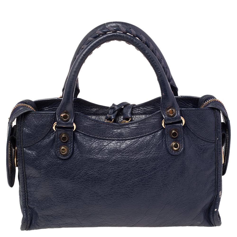 Balenciaga is known for its finely made products and the City bags are one of them. Effortless and stylish, this leather bag will be your go-to for multiple occasions. It has the signature details of buckles, studs, and the front zipper. Two top