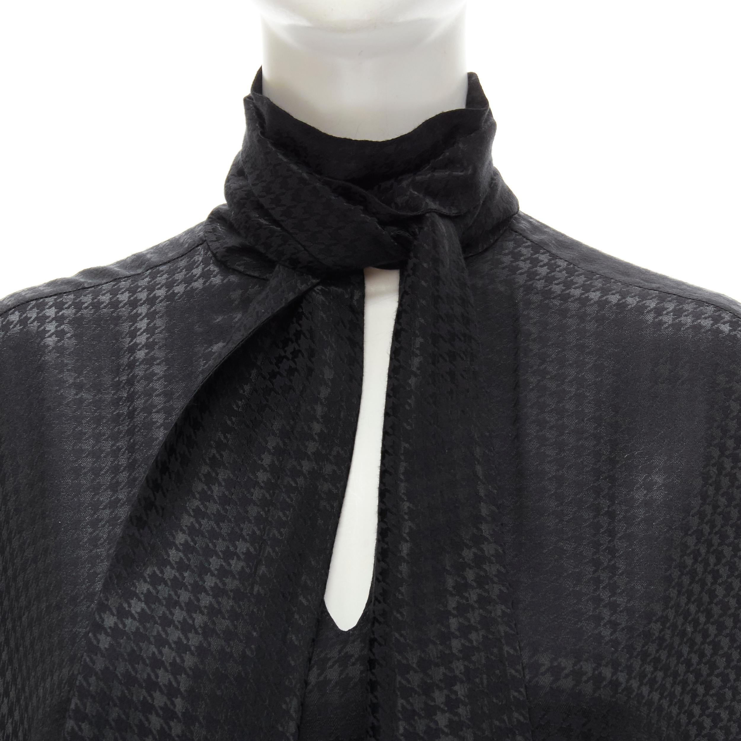 BALENCIAGA DEMNA 2020 black acetate crepe tie neck oversized blouse FR36 S 
Reference: KEDG/A00152 
Brand: Balenciaga 
Designer: Demna 
Collection: 2020 
Material: Viscose 
Color: Black 
Pattern: Houndstooth 
Extra Detail: Tie neck pussy bow.