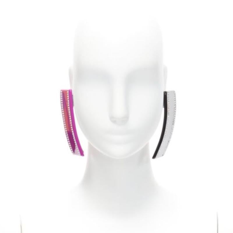 BALENCIAGA Demna Barette pink black crystal statement earring Pair
Reference: BSHW/A00117
Brand: Balenciaga
Designer: Demna
Material: Acrylic
Color: Pink, Black
Pattern: Solid
Closure: Clip On
Lining: Silver Metal
Extra Details: Logo at