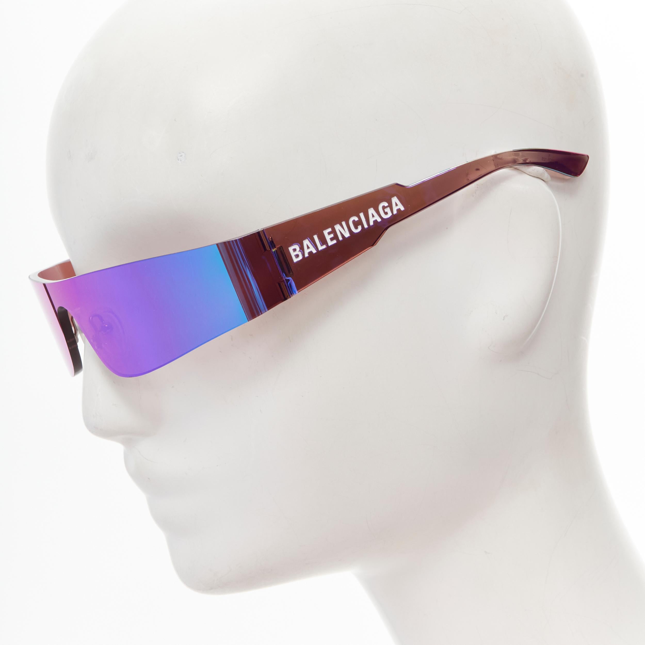 BALENCIAGA DEMNA BB00141S 003 purple reflective futuristic shield sunglasses 
Reference: ANWU/A00083 
Brand: Balenciaga 
Designer: Demna 
Material: Acetate 
Color: Purple 
Pattern: Solid 
Made in: Japan 

CONDITION: 
Condition: Excellent, this item