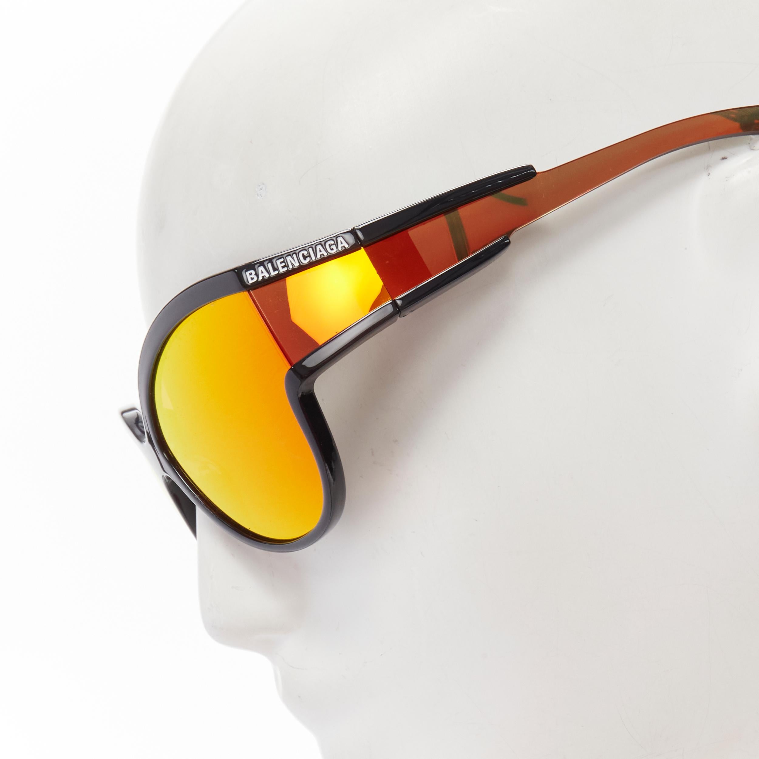 BALENCIAGA DEMNA BB0038S black mirrored orange wrap shield sunglasses 
Reference: ANWU/A00085 
Brand: Balenciaga 
Designer: Demna 
Material: Acetate 
Color: Orange 
Pattern: Solid 
Made in: Italy 


CONDITION: 
Condition: Excellent, this item was