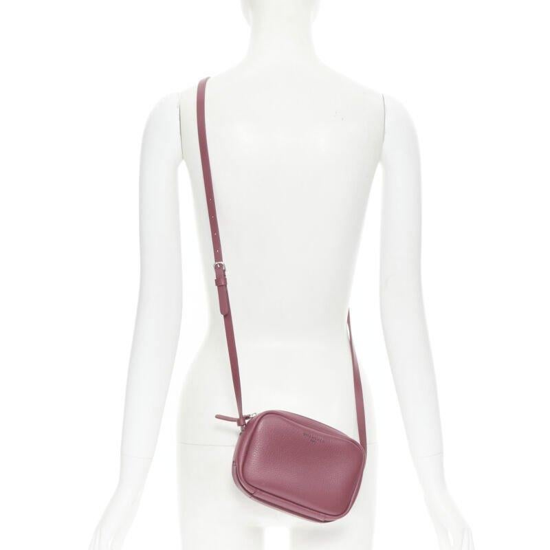 BALENCIAGA Demna Everyday Camera XS burgundy red logo camera crossbody bag
Reference: TGAS/B01350
Brand: Balenciaga
Designer: Demna
Model: Everyday Camera Bag XS
Material: Leather
Color: Red
Pattern: Solid
Closure: Zip
Lining:  Leather
Extra