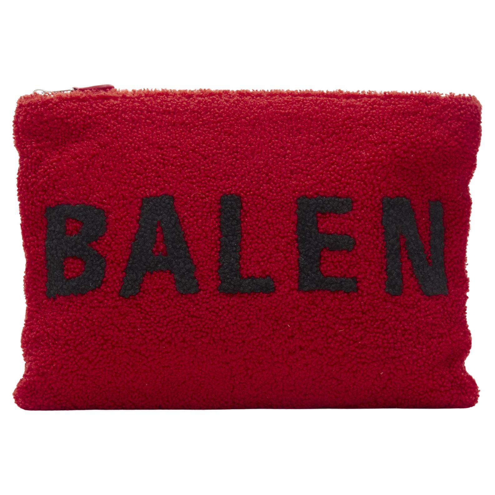 BALENCIAGA Demna logo red black dyed merino lamb shearling zip clutch bag For Sale