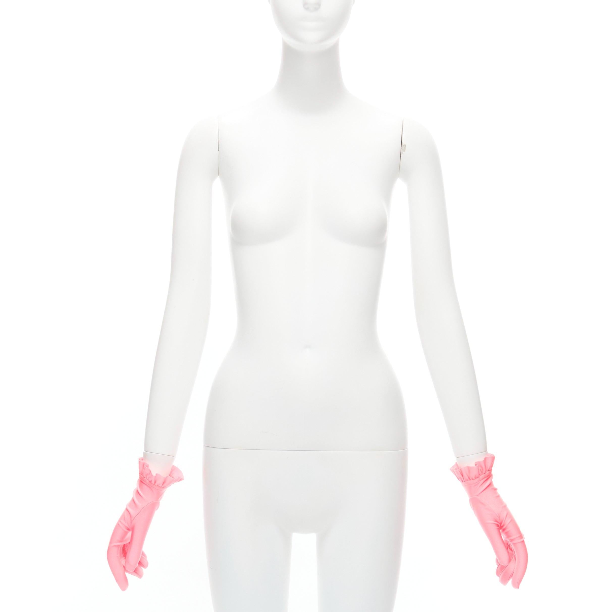 BALENCIAGA Demna shiny pink lycra ruffle edge short gloves
Reference: BSHW/A00128
Brand: Balenciaga
Designer: Demna
Material: Polyamide, Blend
Color: Pink
Pattern: Solid
Closure: Pull On
Lining: Pink Fabric
Made in: Italy

CONDITION:
Condition: