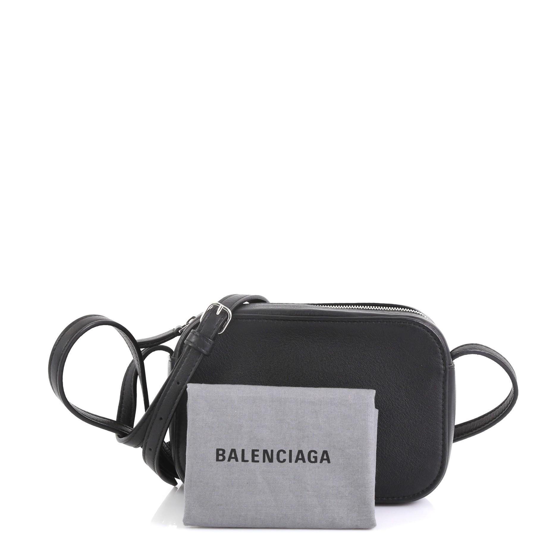 This Balenciaga Everyday Crossbody Bag Leather XS, crafted from black leather, features an adjustable shoulder strap, exterior back pocket and silver-tone hardware. Its zip closure opens to a black leather interior. 

Estimated Retail Price: