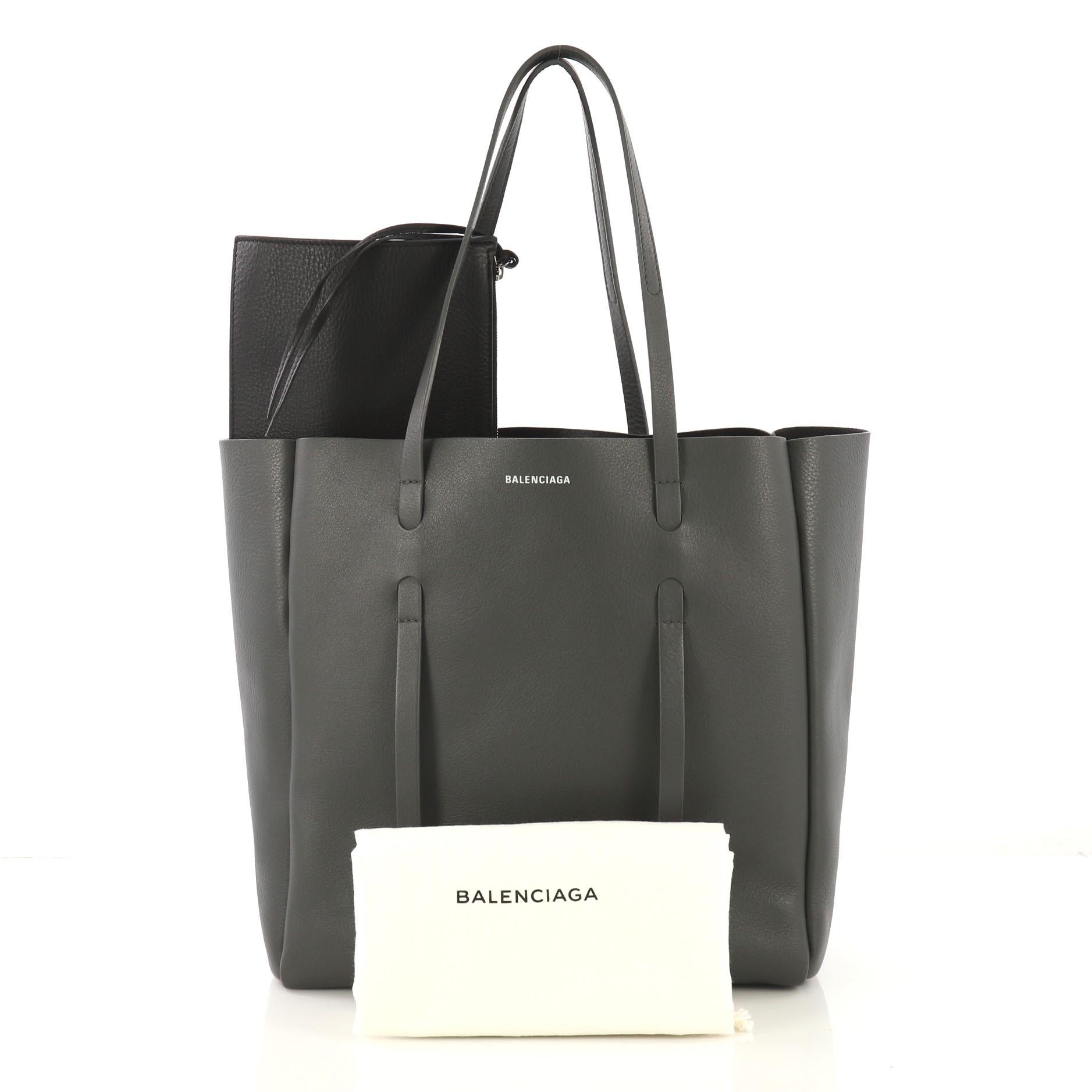This Balenciaga Everyday Tote Leather Small, crafted from gray leather, features dual slim handles and silver-tone hardware. It opens to a black leather interior. 

Estimated Retail Price: $1,185
Condition: Great. Minor wear on base corners, slight
