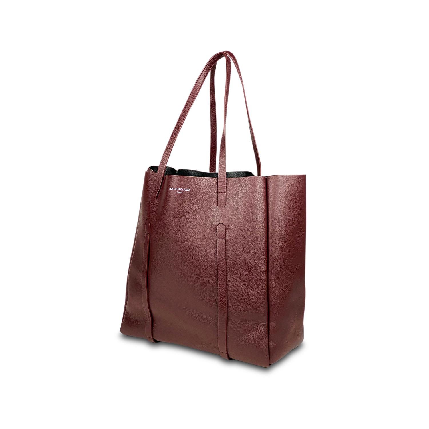 Burgundy calfskin leather Balenciaga Everyday Cabas Tote M with

- Silver-tone hardware
- Dual flat shoulder straps
- Logo foil-stamp at front
- Tonal leather interior lining and open at top

Overall Preloved Condition: Excellent
Exterior Condition: