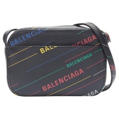 BALENCIAGA Everyday XS Demna black multi logo print small crossbody camera bag