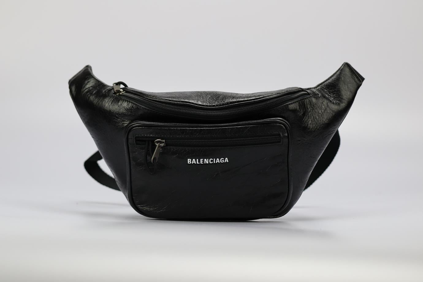 Balenciaga Explorer Crackled Leather Belt Bag. Black. Buckle fastening - Back. Does not come with - dustbag or box. Height: 8.1 In. Width: 14.5 In. Depth: 2.3 In. Handle drop: . Strap drop: 11.3 In. Condition: Used. Very good condition - Worn once.
