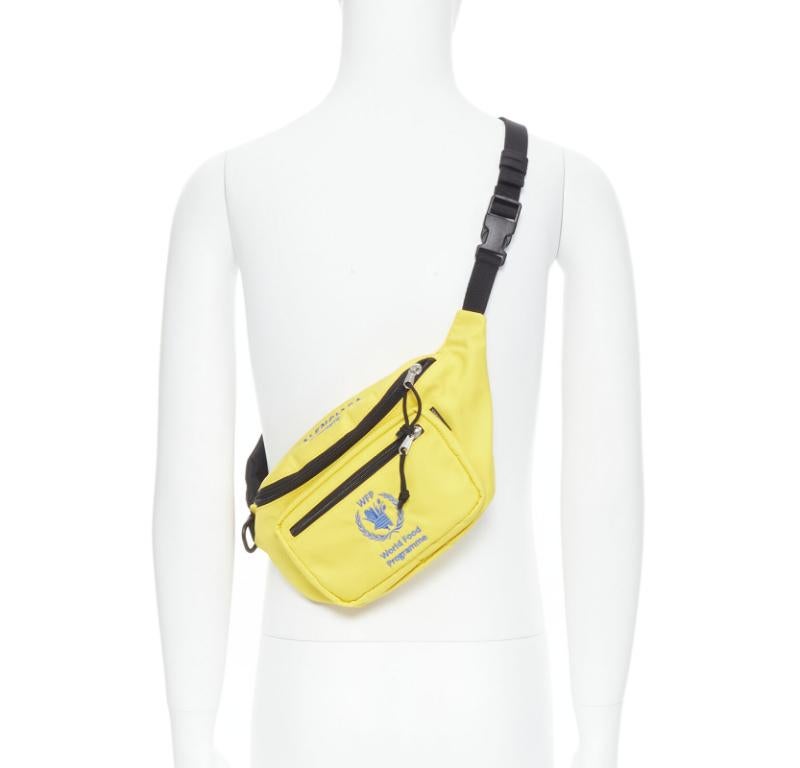 BALENCIAGA Explorer Double Pack Sharp WFP yellow nylon crossbody waist bag
Reference: TGAS/C01405
Brand: Balenciaga
Designer: Demna
Model: double pack sharp pack yellow waist bag
Collection: World Food Programme
Material: Nylon
Color: Yellow,