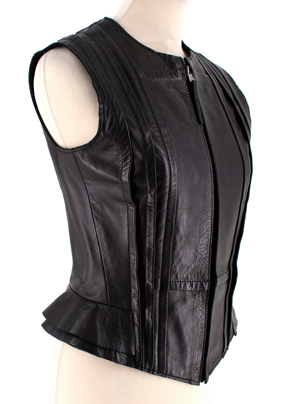 Balenciaga Fitted Dark Brown Leather Sleeveless Vest  

- Fitted
- Tailored Soft Folds 
- Hem Structure and Layer Detailing 
- Centre Zip Fastening 
- Fully Lined 
- Round Neckline
- Single Vent 

Material:
- 100% Lambskin Leather 
- 100% Viscose