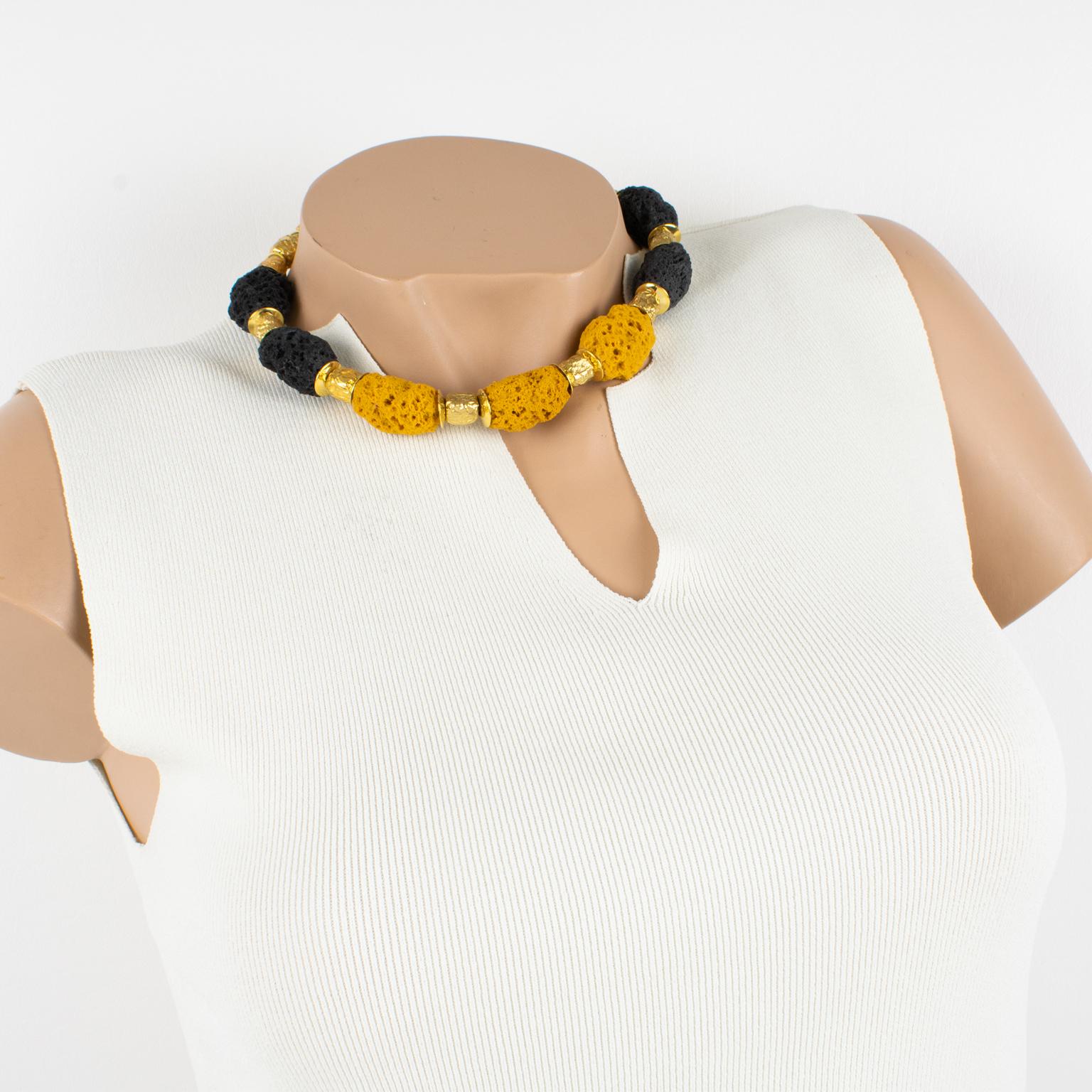 Elegant Balenciaga Paris signed necklace from the 1980s. Features heavy gilt metal carved beaded choker complimented with resin lava rock or sponge-like beads. The resin beads have assorted colors of black and yellow saffron. Locking box clasp with