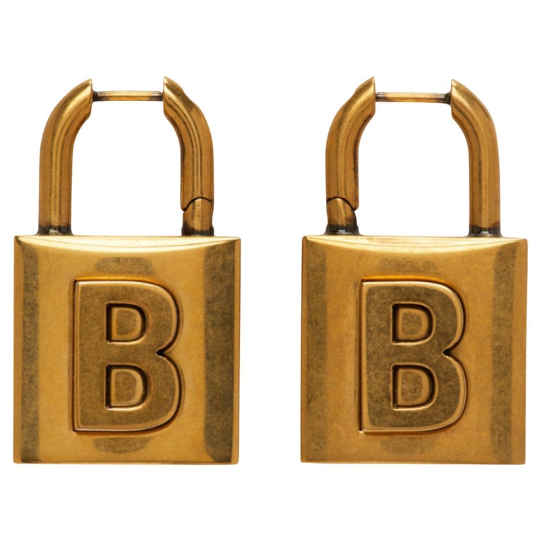 Boucles d'oreilles petit cadenas en métal doré Balenciaga En vente sur  1stDibs