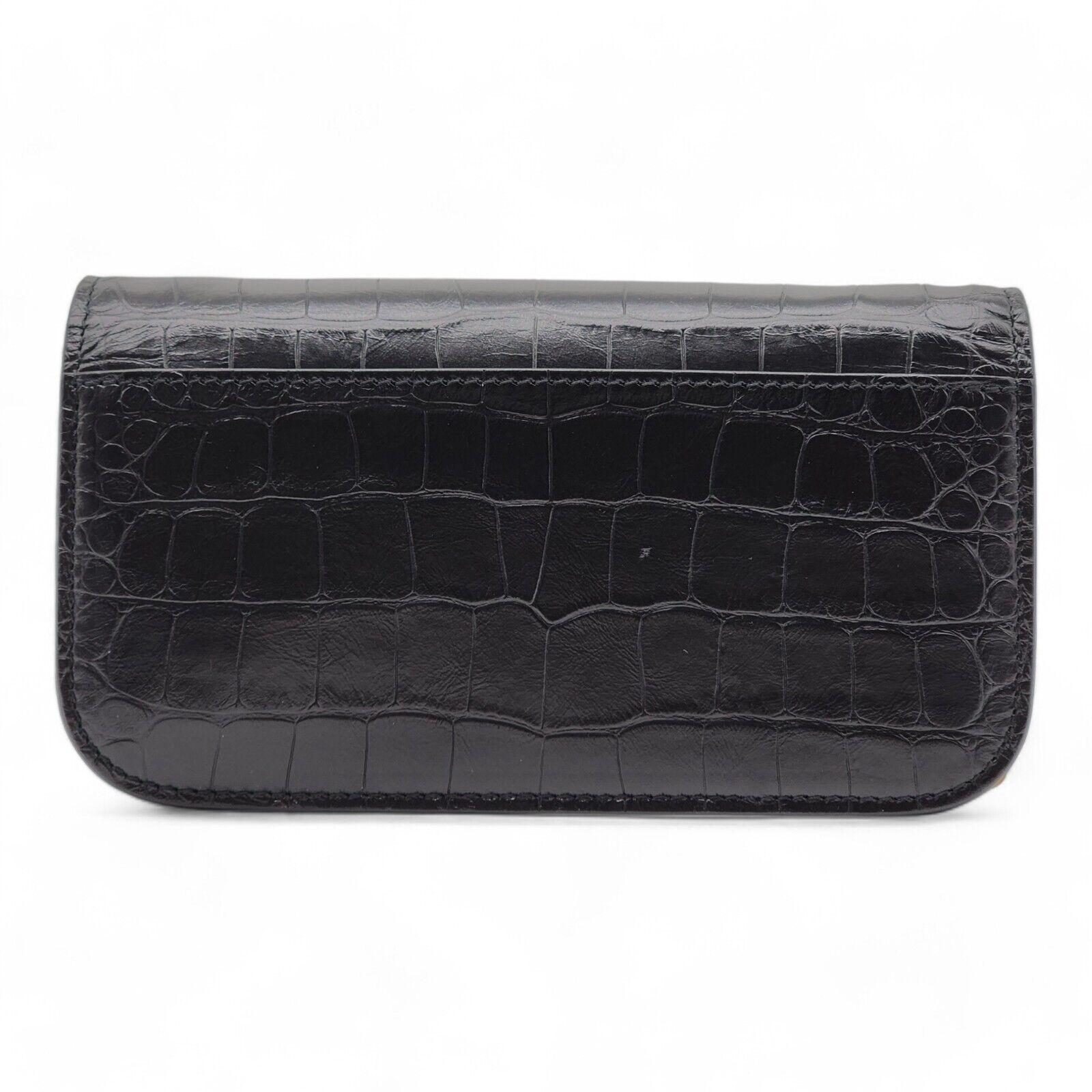 Balenciaga Gossip Wallet On Chain WOC Bag.

Additional information:
Material: Calf leather - Embossed crcodile
Extra supple crocodile embossed calfskin
Flap top with magnetic BB closure
One main compartment
Interior zip and patch pocket
4 interior