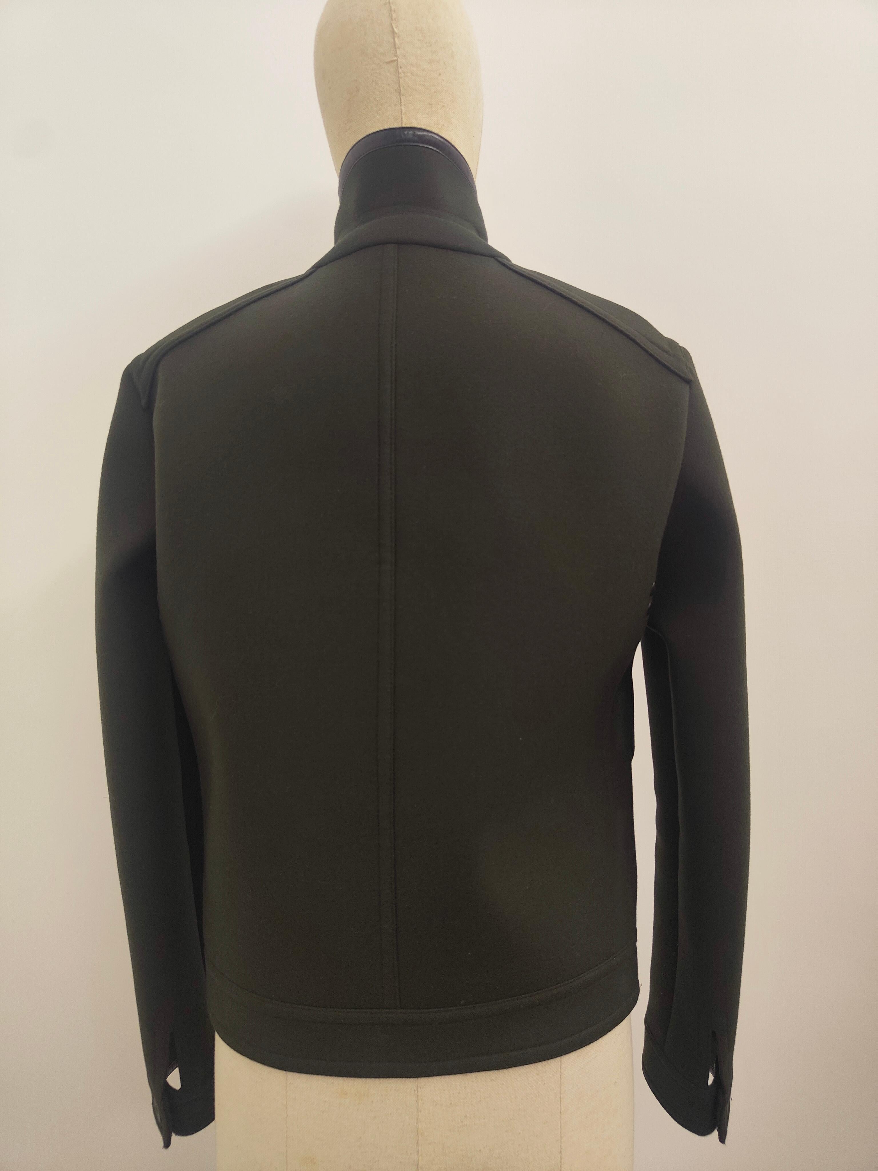 Balenciaga green jacket with black leather inserts
scuba jacket style
size M 