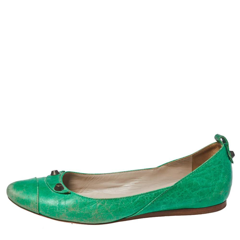 These charming ballet flats by Balenciaga will go with any ensemble. Crafted from leather, they feature round toes and are accented with signature Balenciaga studs and fine stitch details. The leather-lined insoles feature Balenciaga labels.
