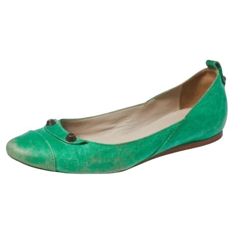 These charming ballet flats by Balenciaga will go with any ensemble. Crafted from leather, they feature round toes and are accented with signature Balenciaga studs and fine stitch details. The leather-lined insoles feature Balenciaga labels.