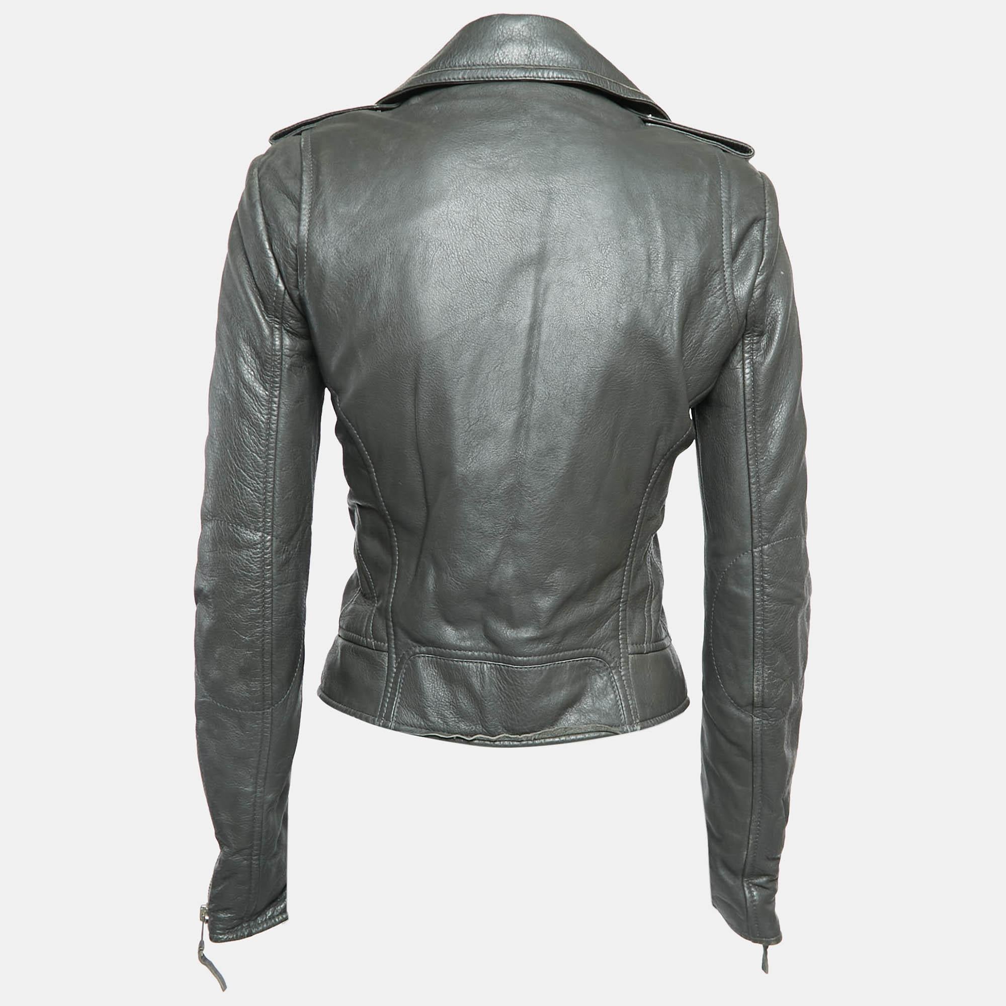 The biker jacket is the epitome of edgy sophistication. Crafted from high quality leather this piece features a sleek tailored silhouette with zip detailing. Its rebellious charm and timeless appeal make it a must have addition to any fashion