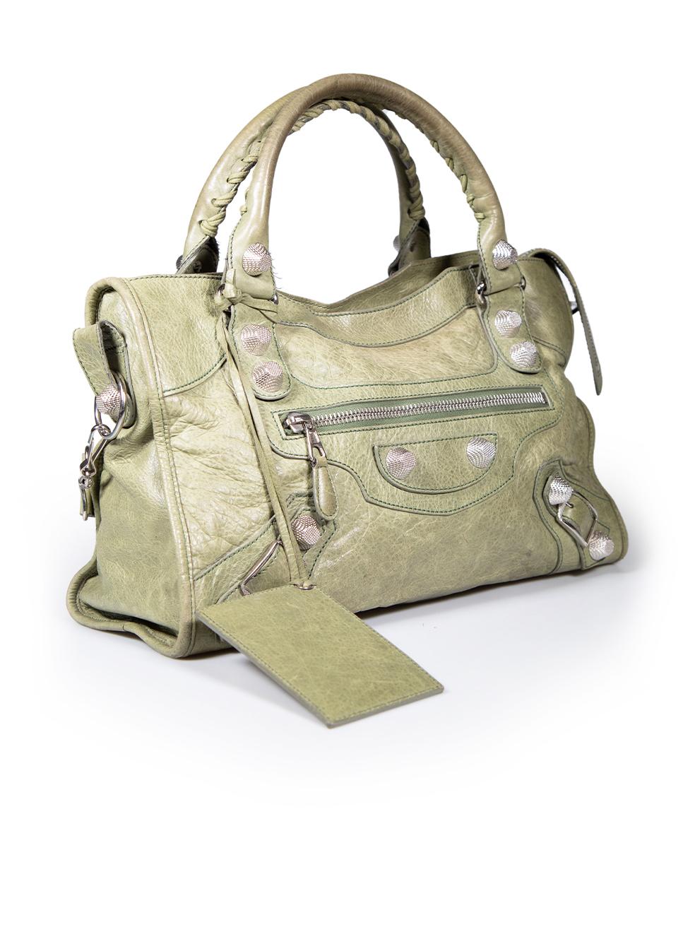 CONDITION is Good. Minor wear to bag is evident. Light wear to the front and the back with abrasions to the leather. The handle trims have also started to fray on this used Balenciaga designer resale item.
 
 
 
 Details
 
 
 Model: City
 
 Green
 
