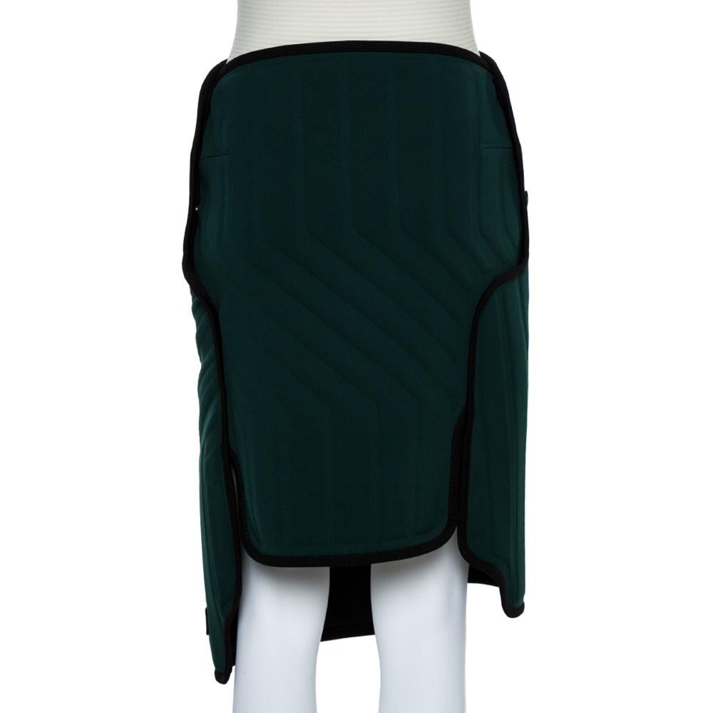 Balenciaga brings you this skirt that is well-made and high in style. It comes made into a lovely shape and designed in an asymmetric wrap style and detailed with contrast trims and button closure. The design has a scuba, car-mat look.

