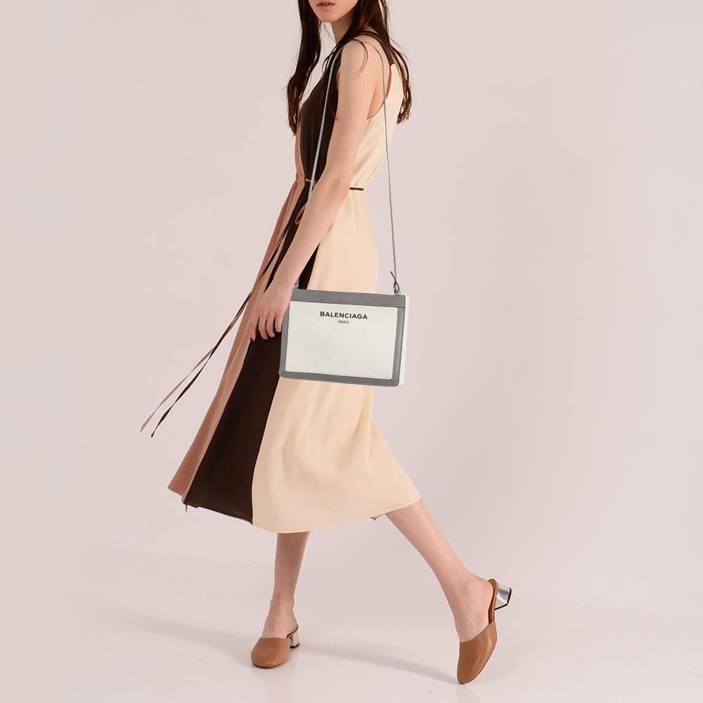 This crossbody bag by Balenciaga is a great option for carrying your essentials. This canvas and leather bag has a compact size and a zipper to secure the interior. Designed to be ideal for everyday use this crossbody bag is a must have.