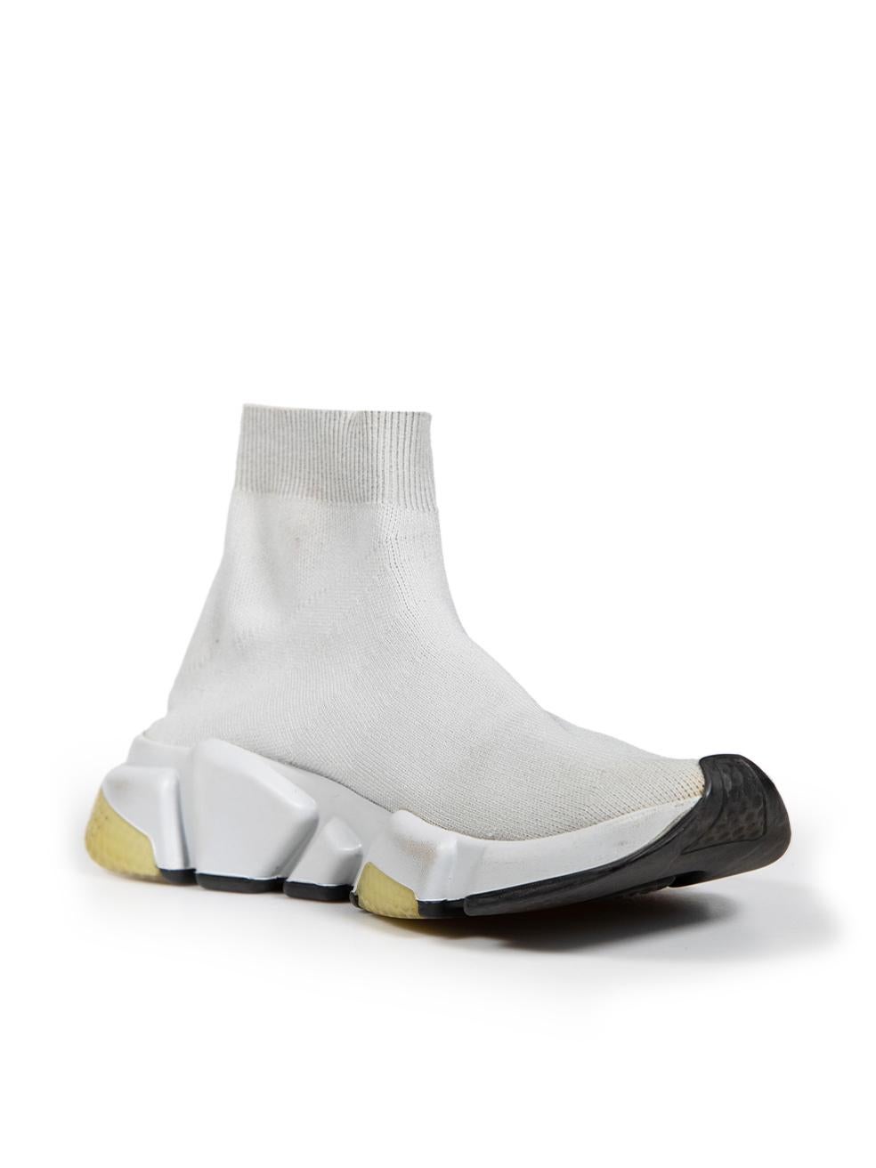CONDITION is Good. Minor wear to trainers is evident. Light discolouration to the rear inner side and tip of the right shoe as well as both rubber soles. The paint coating on both rubber soles is slightly cracked. A loose thread to the rear seam is