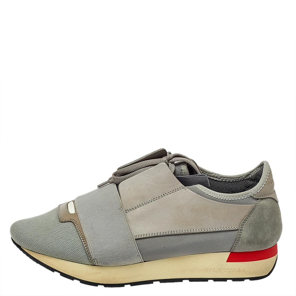 Let your latest shoe addition be this pair of Race Runner sneakers from Balenciaga. These grey sneakers have been crafted from mesh, suede, and leather and feature a chic silhouette. They flaunt covered toes, strap detailing on the vamps, and tie-up