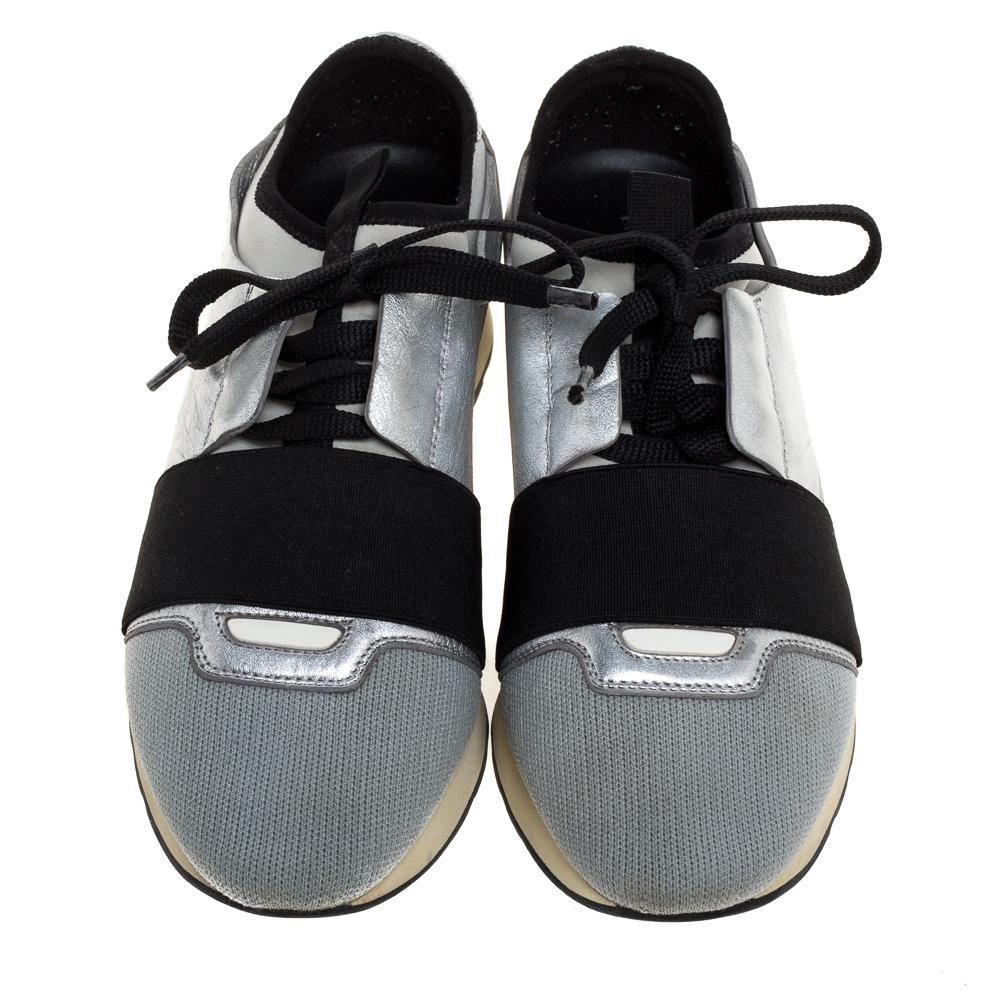 Let your latest shoe addition be this pair of Race Runner sneakers from Balenciaga. These silver sneakers have been crafted from leather And fabric and feature a chic silhouette. They flaunt round toes, strap detailing on the vamps and tie-up
