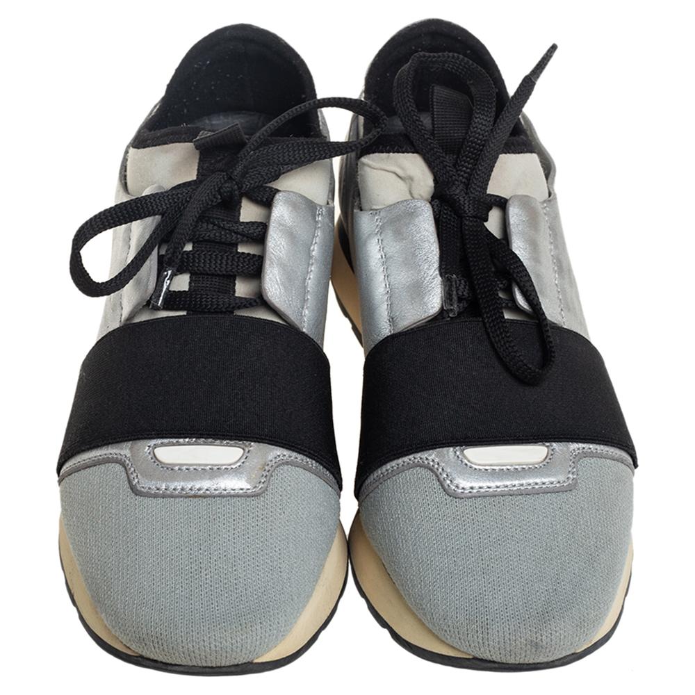 Let your latest shoe addition be this pair of Balenciaga Race Runners sneakers. These sneakers have been crafted from leather and knit fabric and feature a chic silhouette. They flaunt covered toes, strap detailing on the vamps, and tie-up
