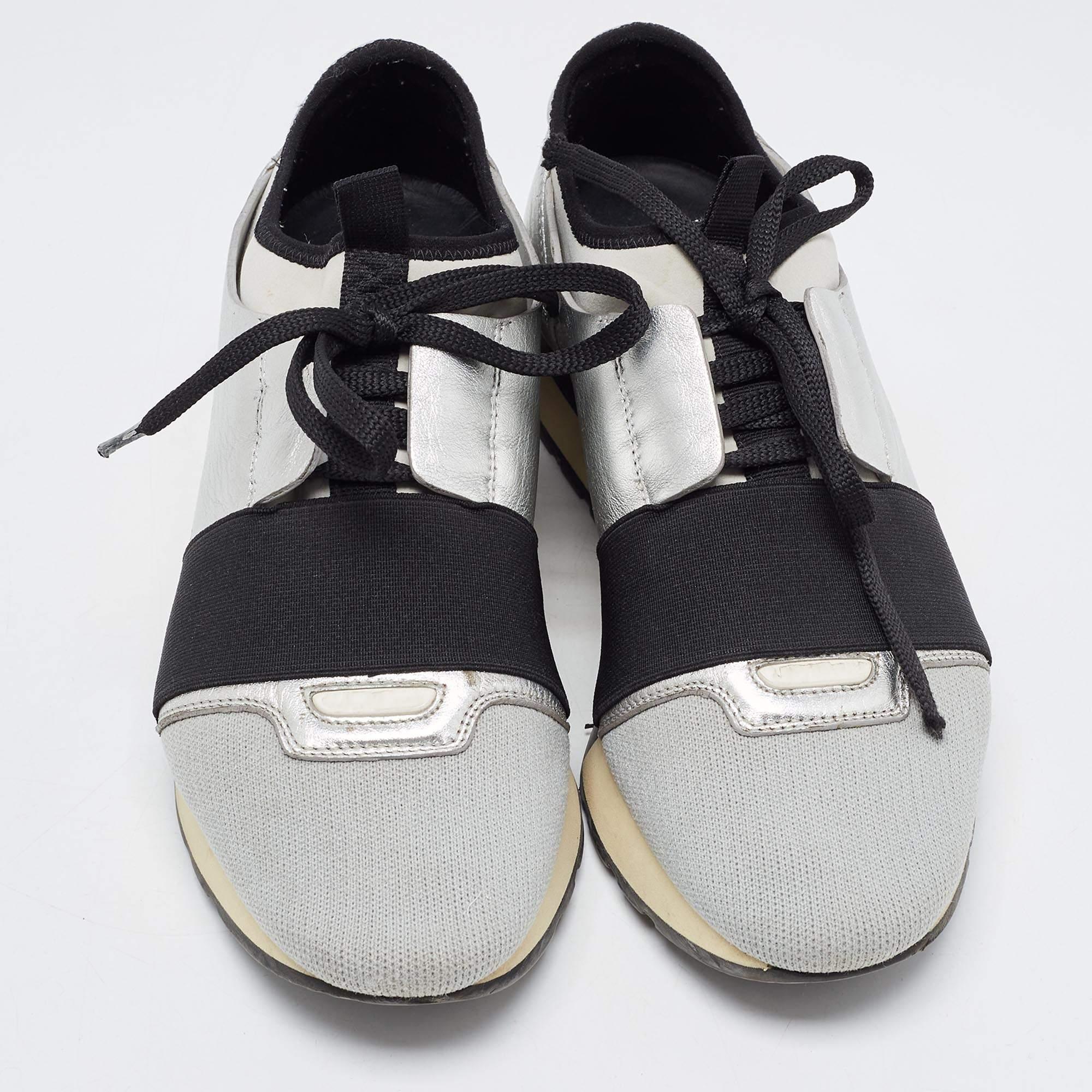 The Balenciaga Race Runner sneakers have been crafted from quality materials and feature a chic silhouette. They flaunt covered toes, strap detailing on the vamps, and tie-up fastenings. They are complete with a leather-lined insole and a tough base
