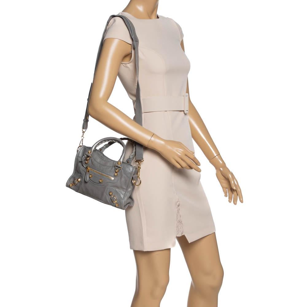 Balenciaga is known for its finely made designs and the City bags are one of them. Effortless and stylish, this leather bag will be your go-to for multiple occasions. It has the signature details of buckles, studs, and the front zipper. Two top
