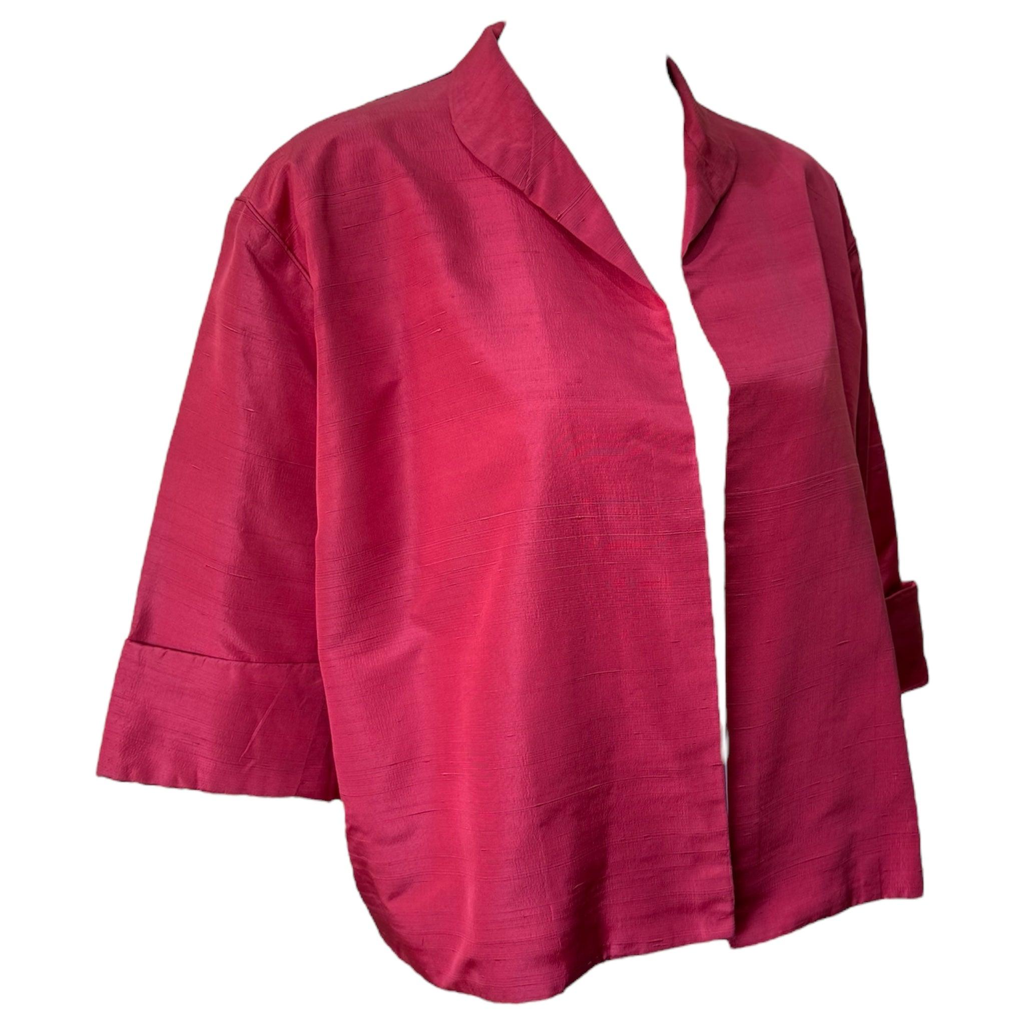 Balenciaga haute couture early 1960's red silk evening jacket. Cropped swing bolero silhouette. Features a slight collar and cuffed half-sleeves. Matte red dupioni silk. Fully lined. Light wear and in great vintage condition. Fits a size Small to