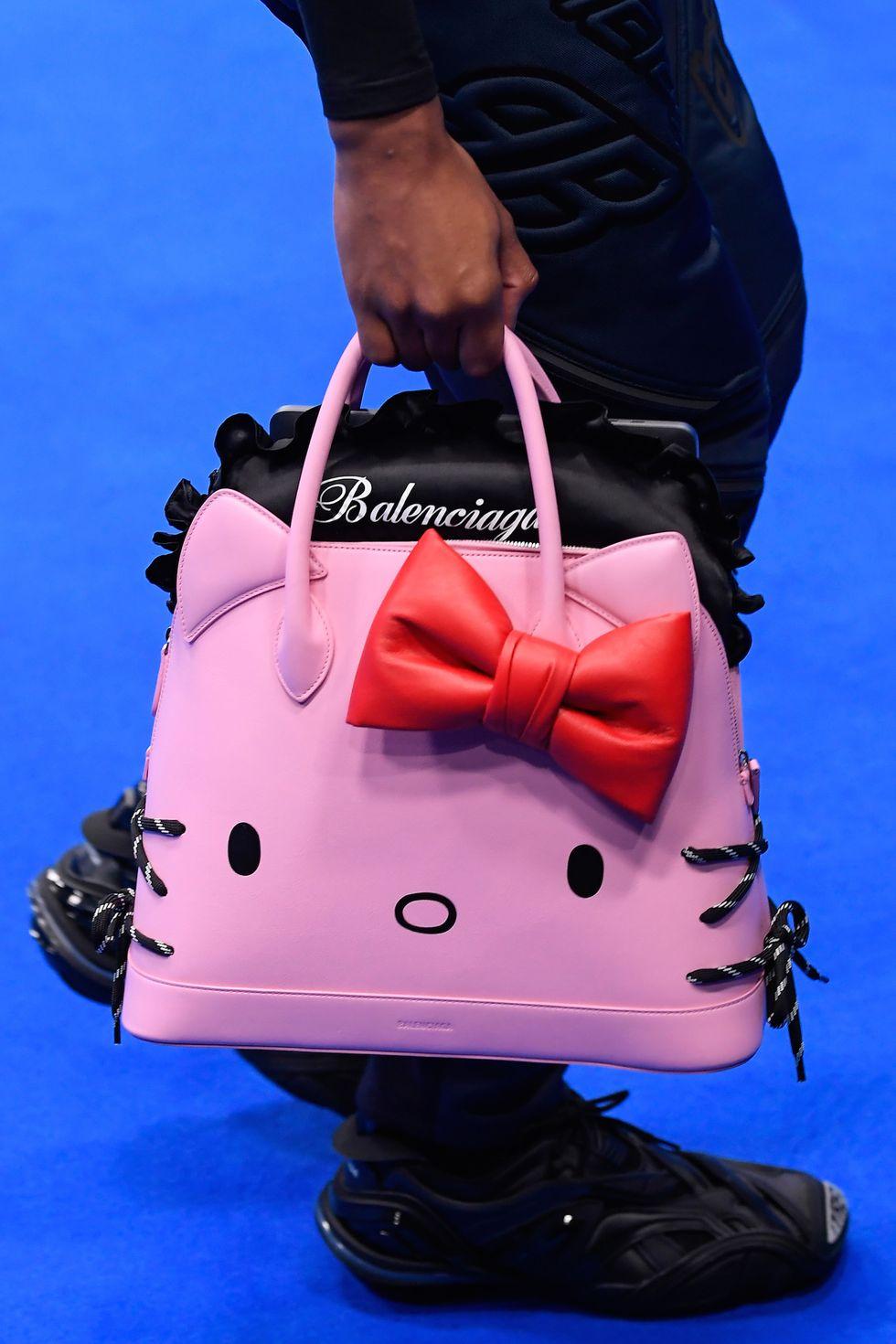 Balenciaga HELLO KITTY Baby Pink color  Ville Handbag With Strap and tags 
Rare and  limited size.
Designed in collaboration with Hello Kitty, Balenciaga's bag is complete with ears, a bow and whiskers, which are created using the laces from the