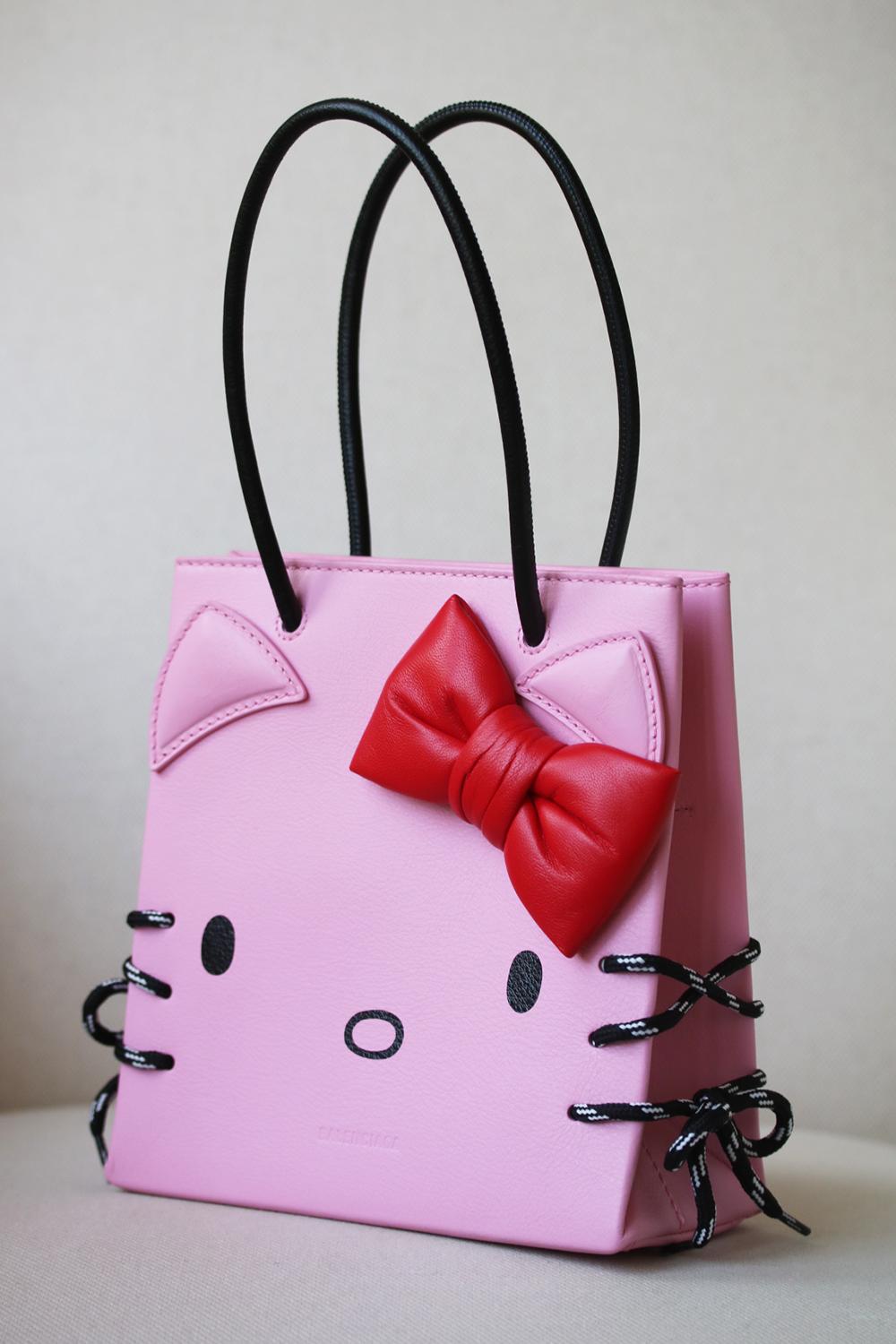 Designed in collaboration with Hello Kitty, Balenciaga's bag is complete with ears, a bow and whiskers, which are created using the laces from the brand's iconic Triple S sneakers. This small style has been made in Italy from baby-pink leather and
