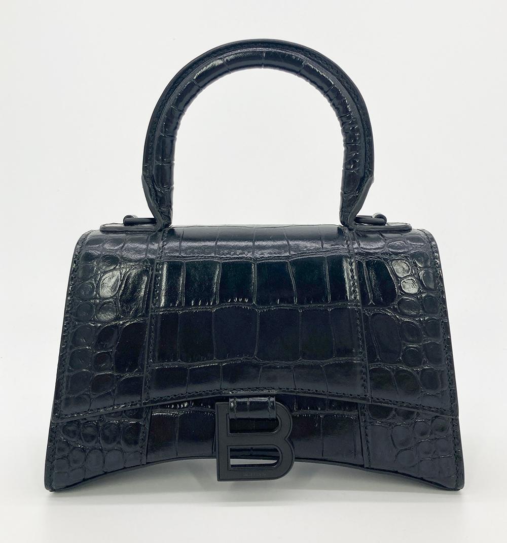 Balenciaga Hourglass Mini Black Embossed Crocodile in excellent condition. Embossed Black calfskin exterior trimmed with matte black hardware. Front flap snap closure opens to a black lambskin leather interior. Clean corners edges and interior. A